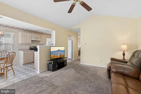 a living room with furniture and flat screen tv