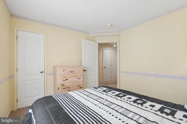 a bedroom with a bed and a cabinets