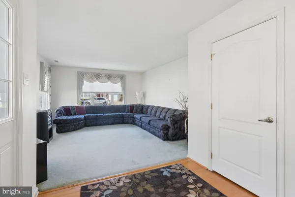a living room with furniture and a rug
