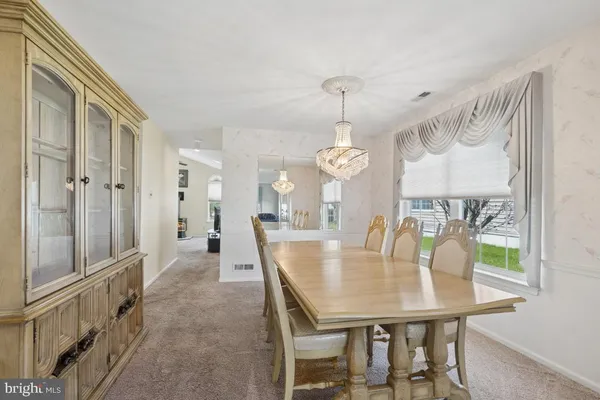 a view of a dining room and livingroom