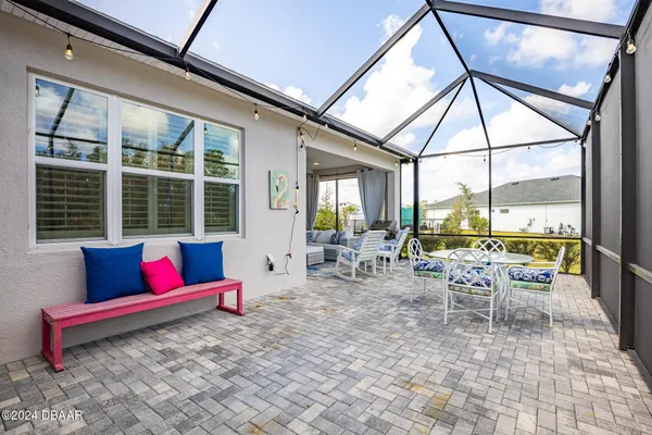 a bedroom with a bed and a lamp