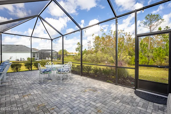a bedroom with a bed and a flat screen tv in it