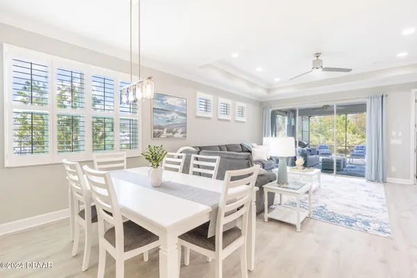 a view of a dining room with furniture window and outside view