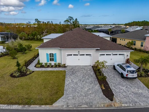 a view of a chairs and table in the patio