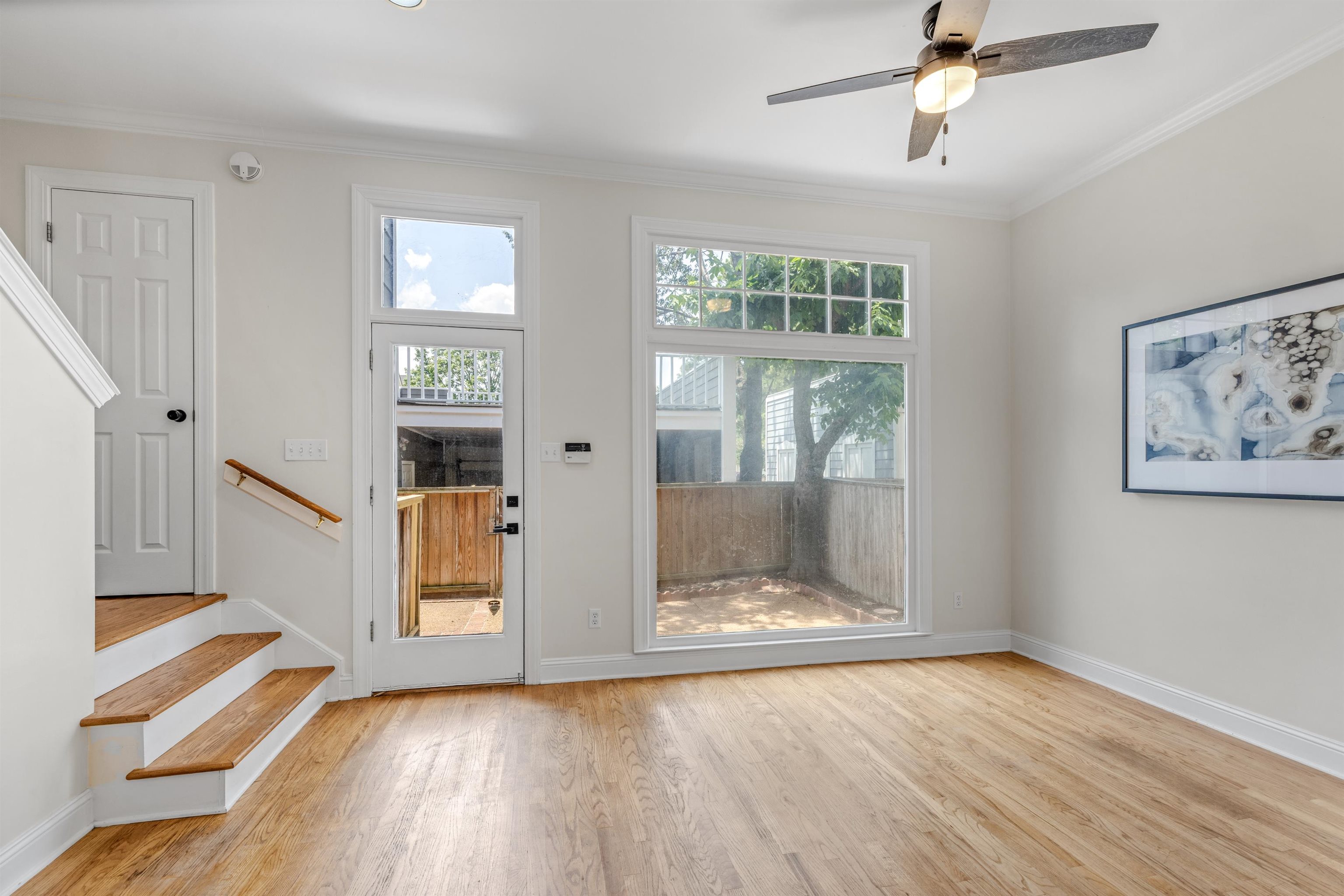 921 Harbor View Drive Memphis, TN 38103 - Photo 17 of 33 Light wood-finish flooring complemented by white baseboards and walls