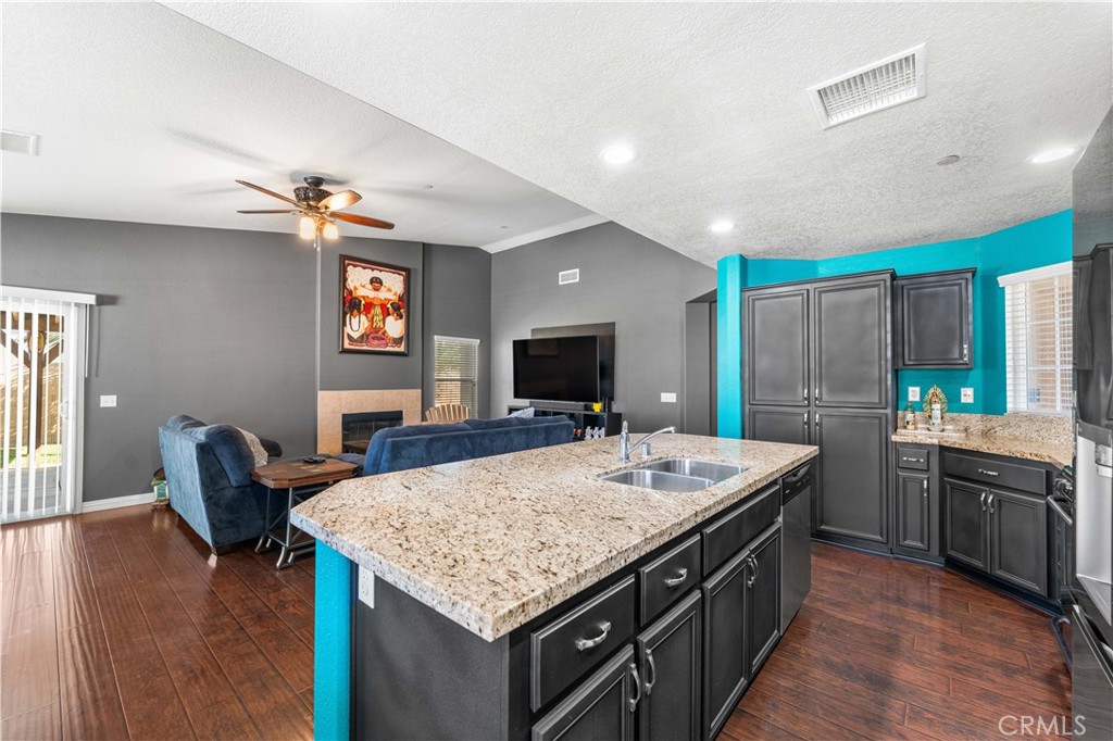 37068 Waltham Place Palmdale, CA 93550 - Photo 18 of 36 a kitchen with a stove and a refrigerator