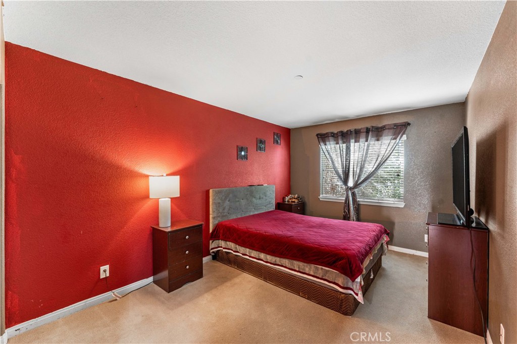 37068 Waltham Place Palmdale, CA 93550 - Photo 25 of 36 a bedroom with a bed and window