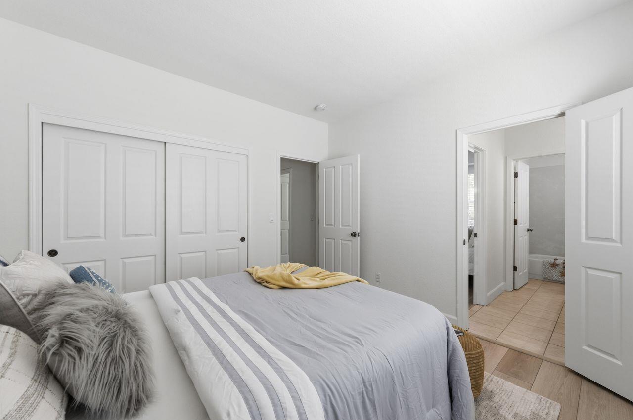 698 West Rico Way Tracy, CA 95391 - Photo 27 of 38 a bedroom with a bed and a closet