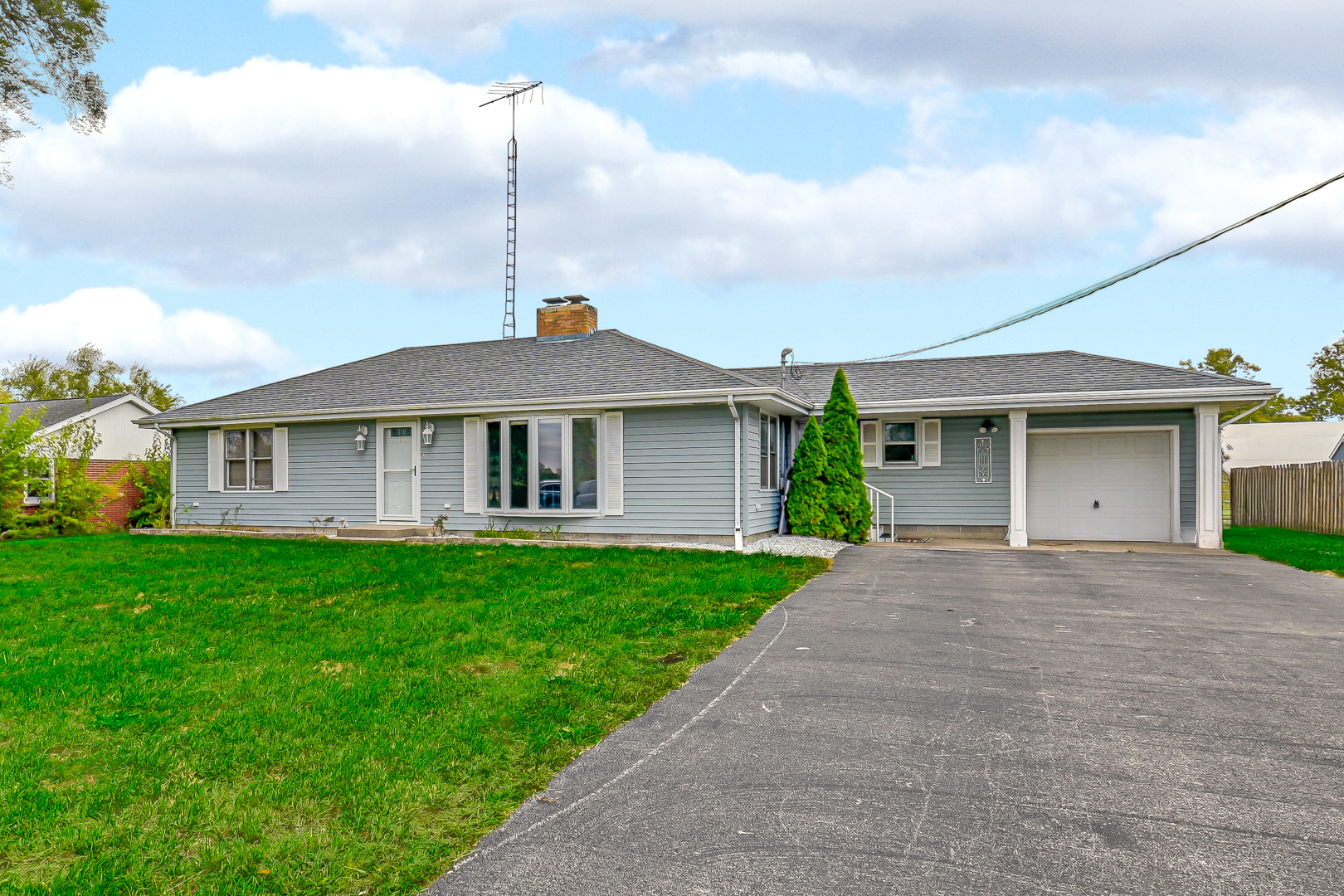 59 North 2750W Road Kankakee, IL 60901 - Photo 2 of 19 a front view of a house with a garden