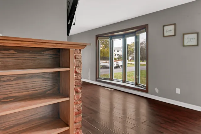 a view of room with wooden floor and window