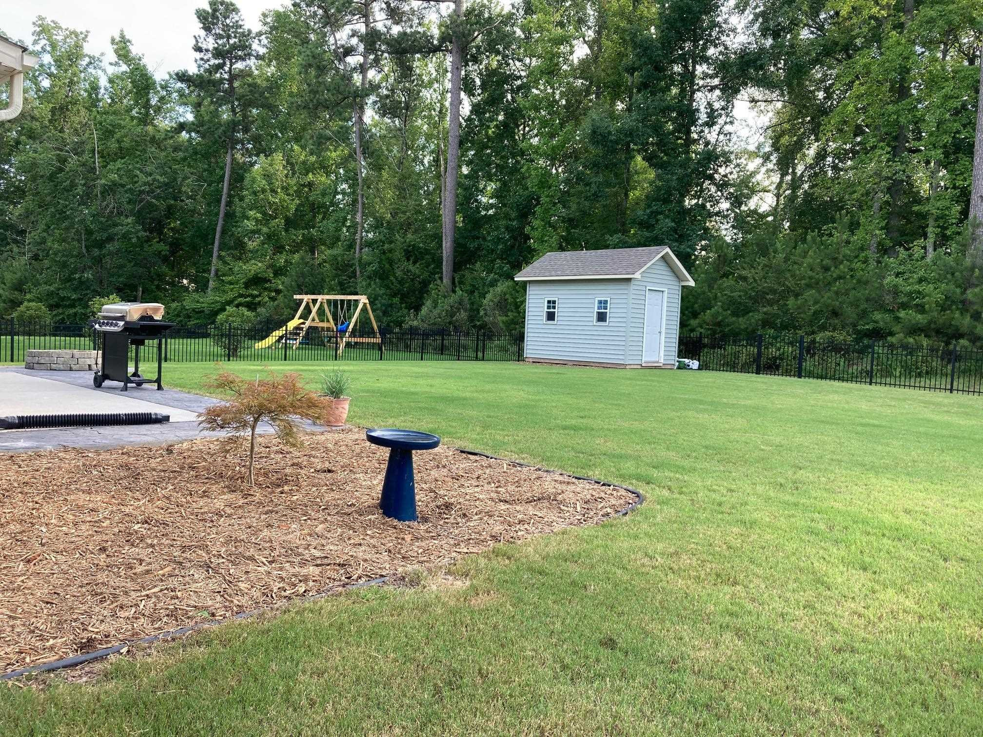 3437 Grosbeak Way Raleigh, NC 27616 - Photo 10 of 11 Flat Backyard