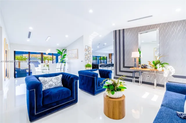 a living room with furniture and white walls