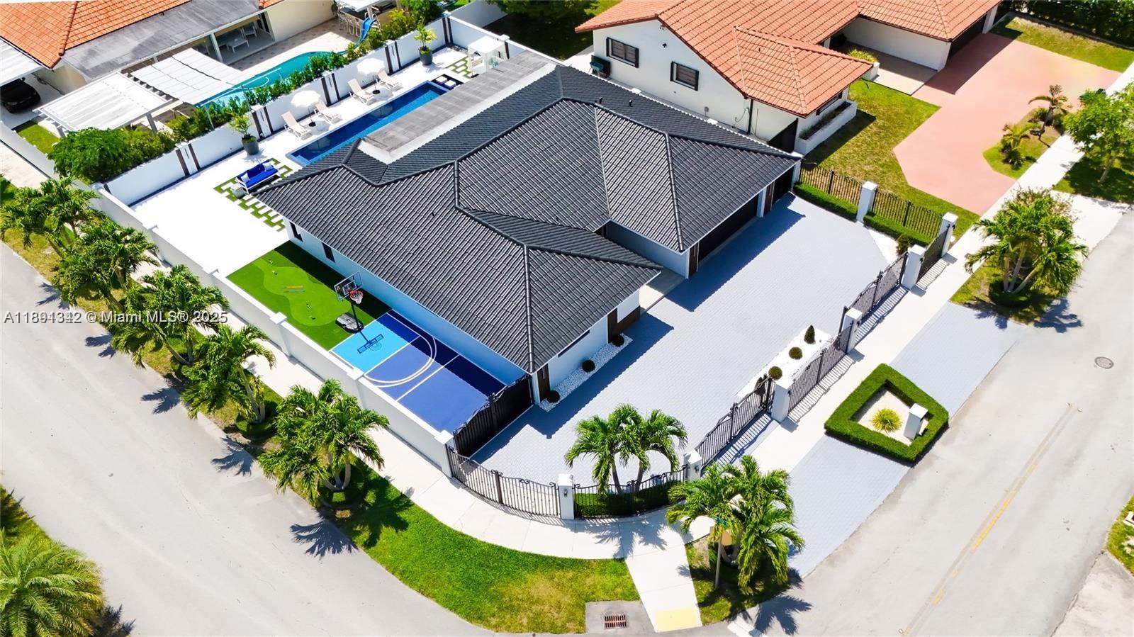 3221 Southwest 140th Avenue Miami, FL 33175 - Photo 2 of 19 an aerial view of a house with a yard and outdoor seating