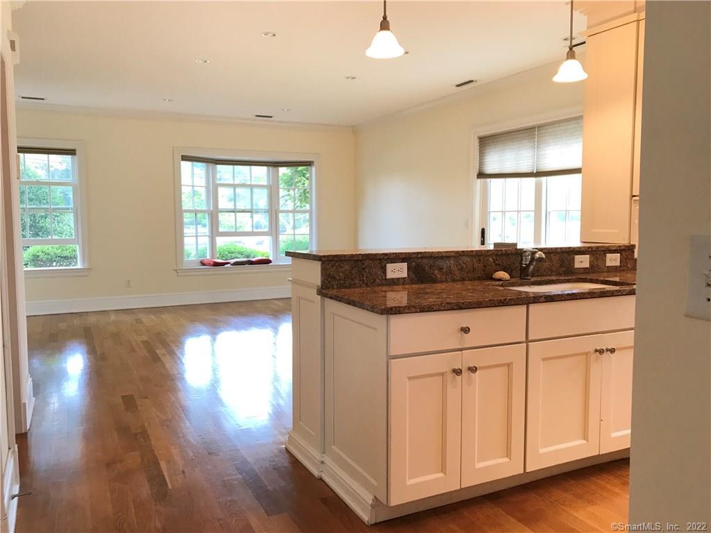 220 Riverside Avenue, Unit 4 Westport, CT 06880 - Photo 1 of 1 Kitchen into living room facing river