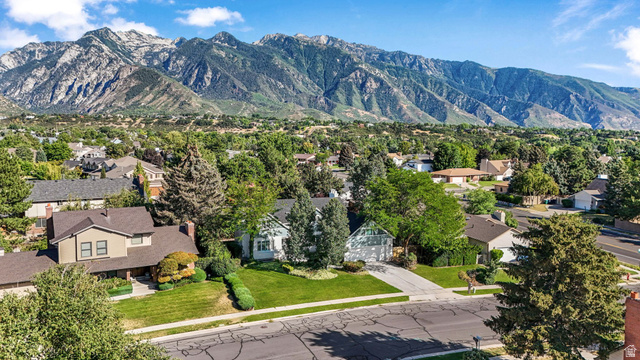 8965 Quail Run Drive Sandy, UT 84093 - Photo 10 of 56 Aerial perspective of suburban area with mountains