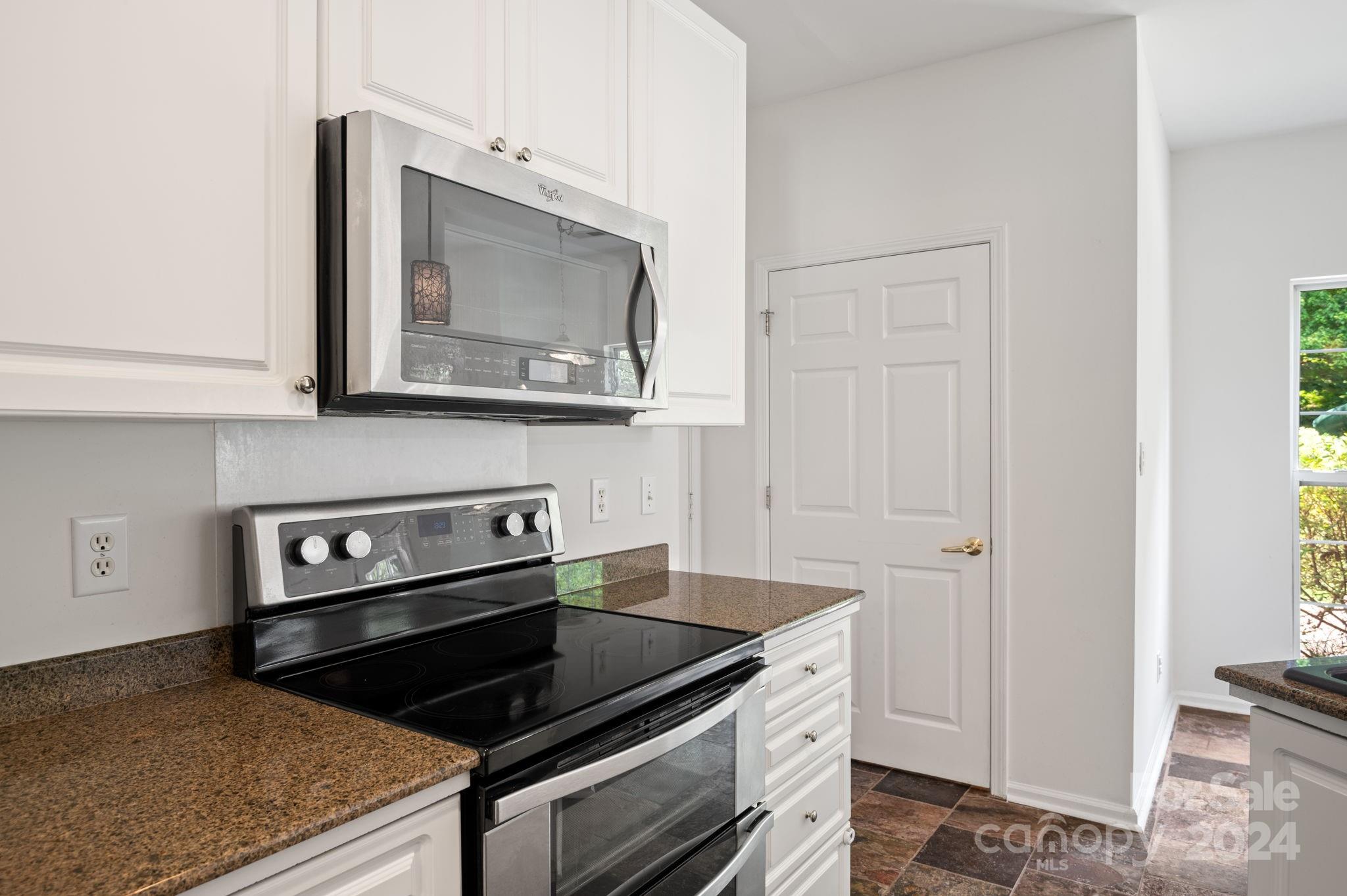 736 West Cheval Drive Fort Mill, SC 29708 - Photo 16 of 44 a kitchen with a stove and a microwave