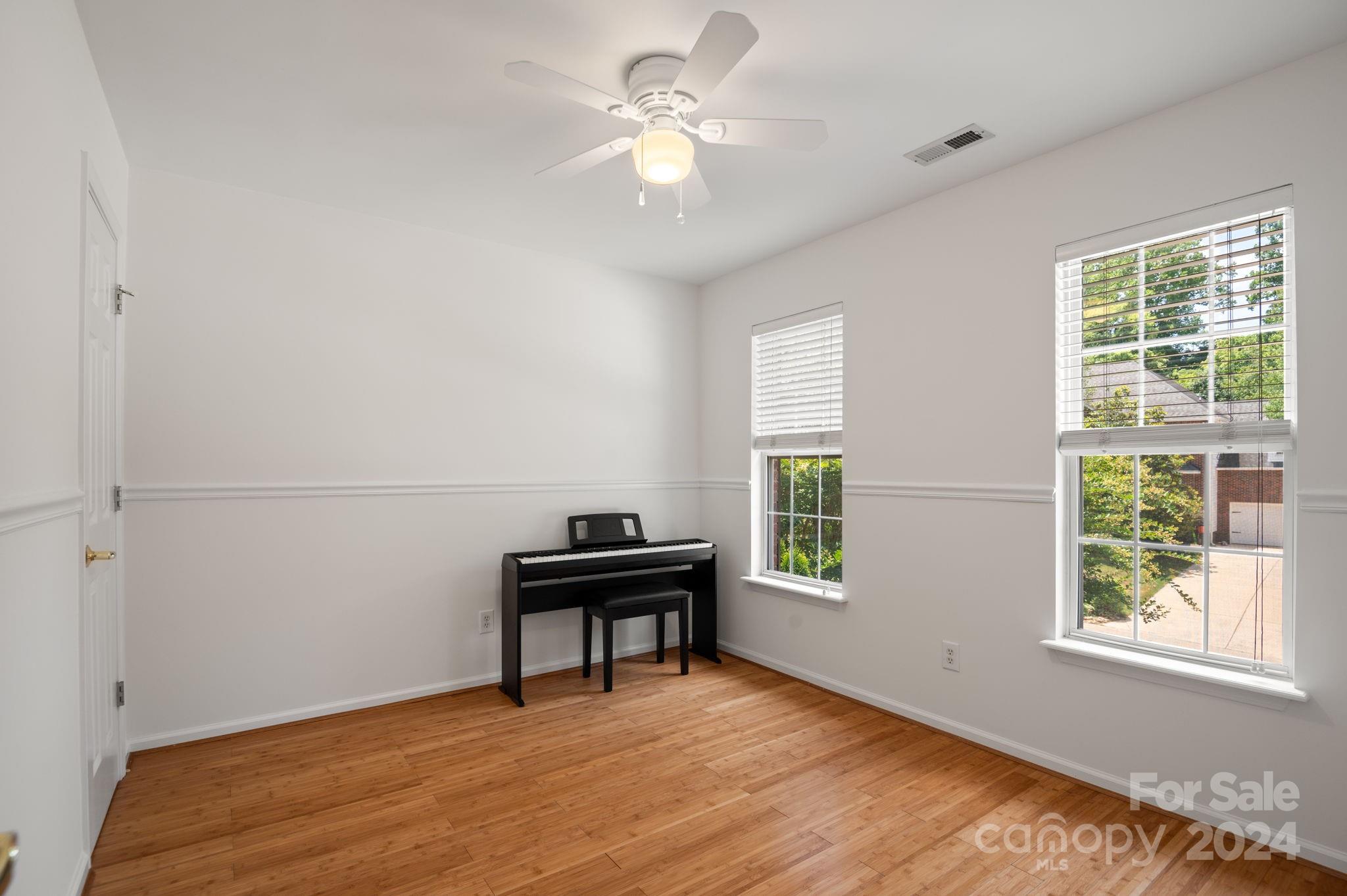 736 West Cheval Drive Fort Mill, SC 29708 - Photo 24 of 44 a view of an empty room with window and wooden floor