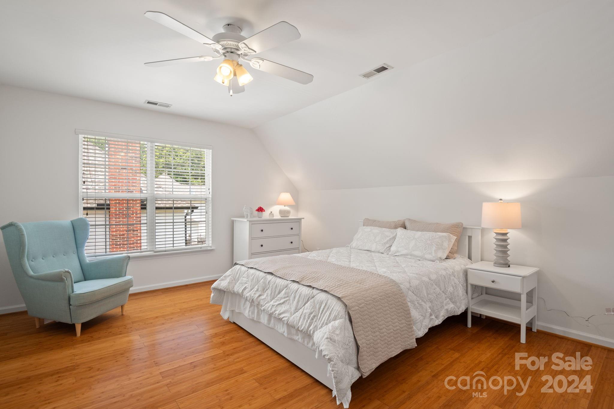 736 West Cheval Drive Fort Mill, SC 29708 - Photo 29 of 44 a bedroom with a bed and a couch