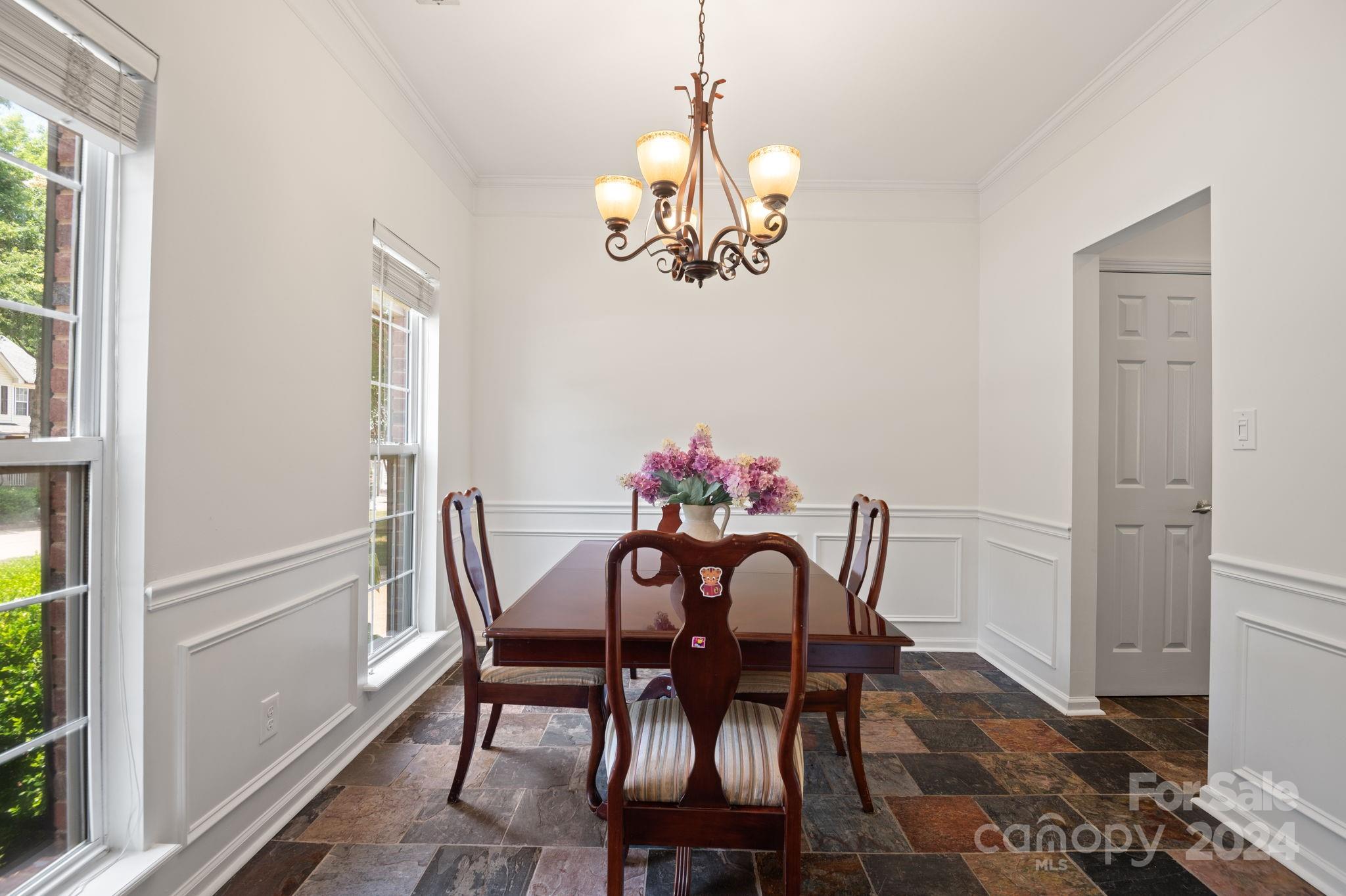 736 West Cheval Drive Fort Mill, SC 29708 - Photo 5 of 44 a view of a dining room with furniture a chandelier and wooden floor