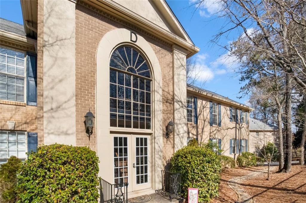 750 Dalrymple Road, Unit D3 Sandy Springs, GA 30328 - Photo 1 of 1 a view of a brick house with large windows
