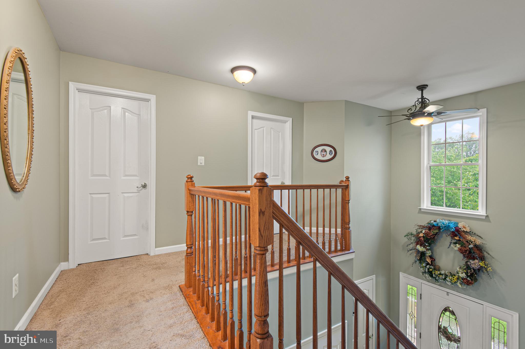 985 Silver Maple Circle Seven Valleys, PA 17360 - Photo 19 of 50 a view of a hallway to a window and stairs