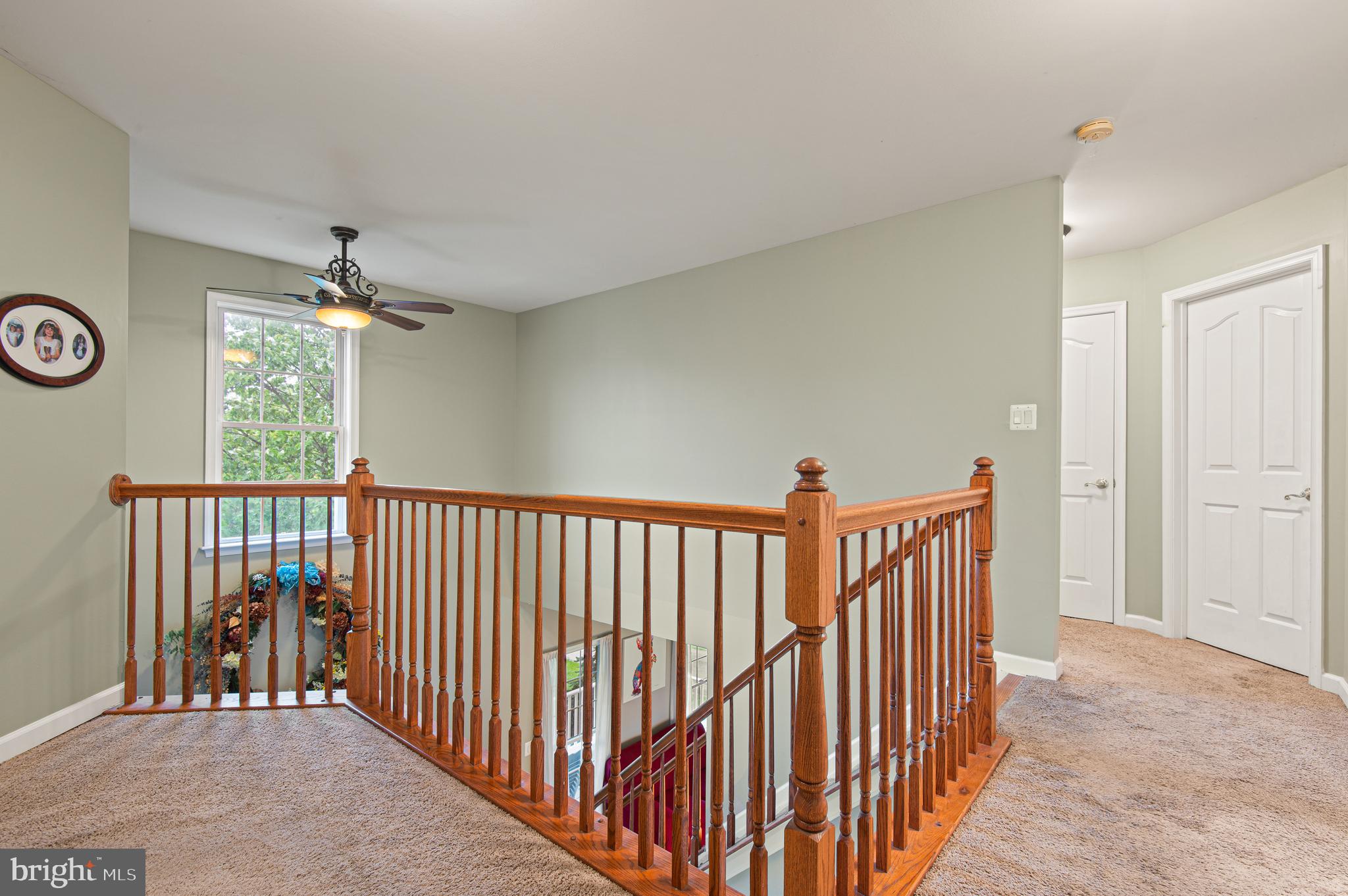 985 Silver Maple Circle Seven Valleys, PA 17360 - Photo 28 of 50 a view of a hallway to a bedroom with wooden floor and windows