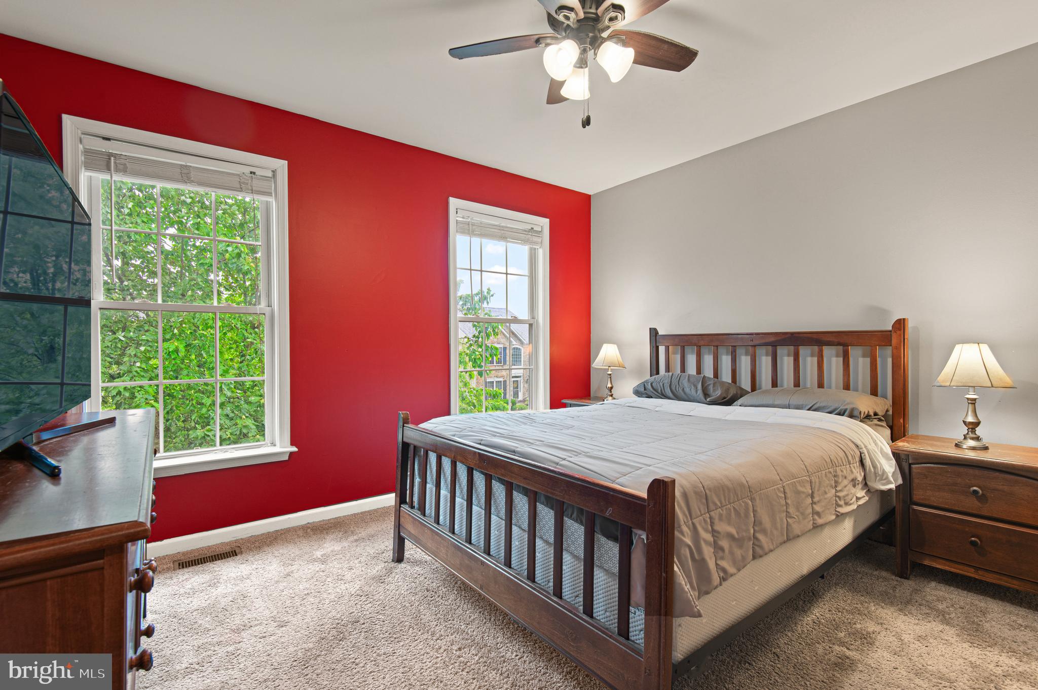 985 Silver Maple Circle Seven Valleys, PA 17360 - Photo 32 of 50 a bedroom with a bed and a chandelier