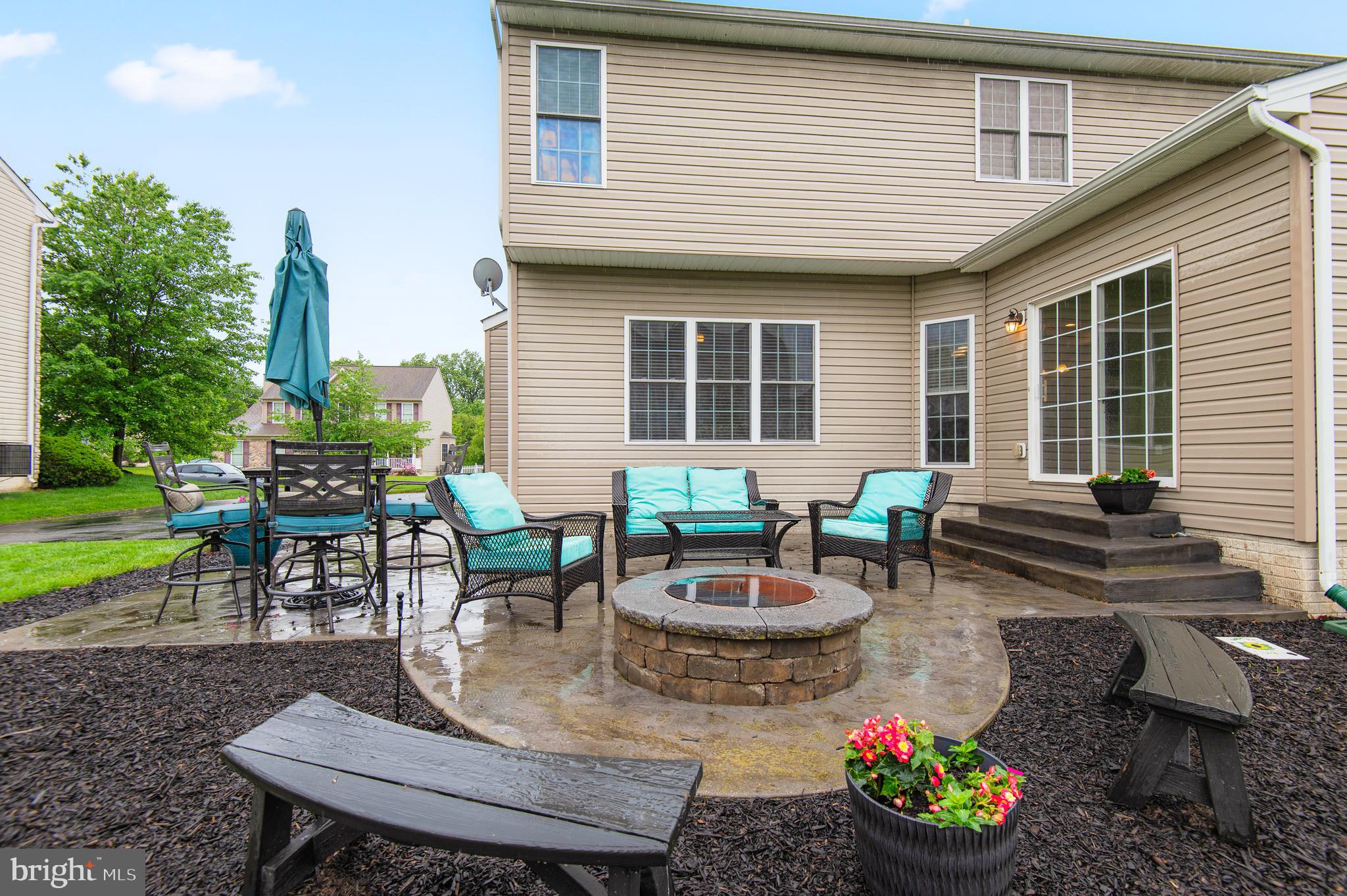 985 Silver Maple Circle Seven Valleys, PA 17360 - Photo 40 of 50 a view of a house with backyard sitting area and a garden