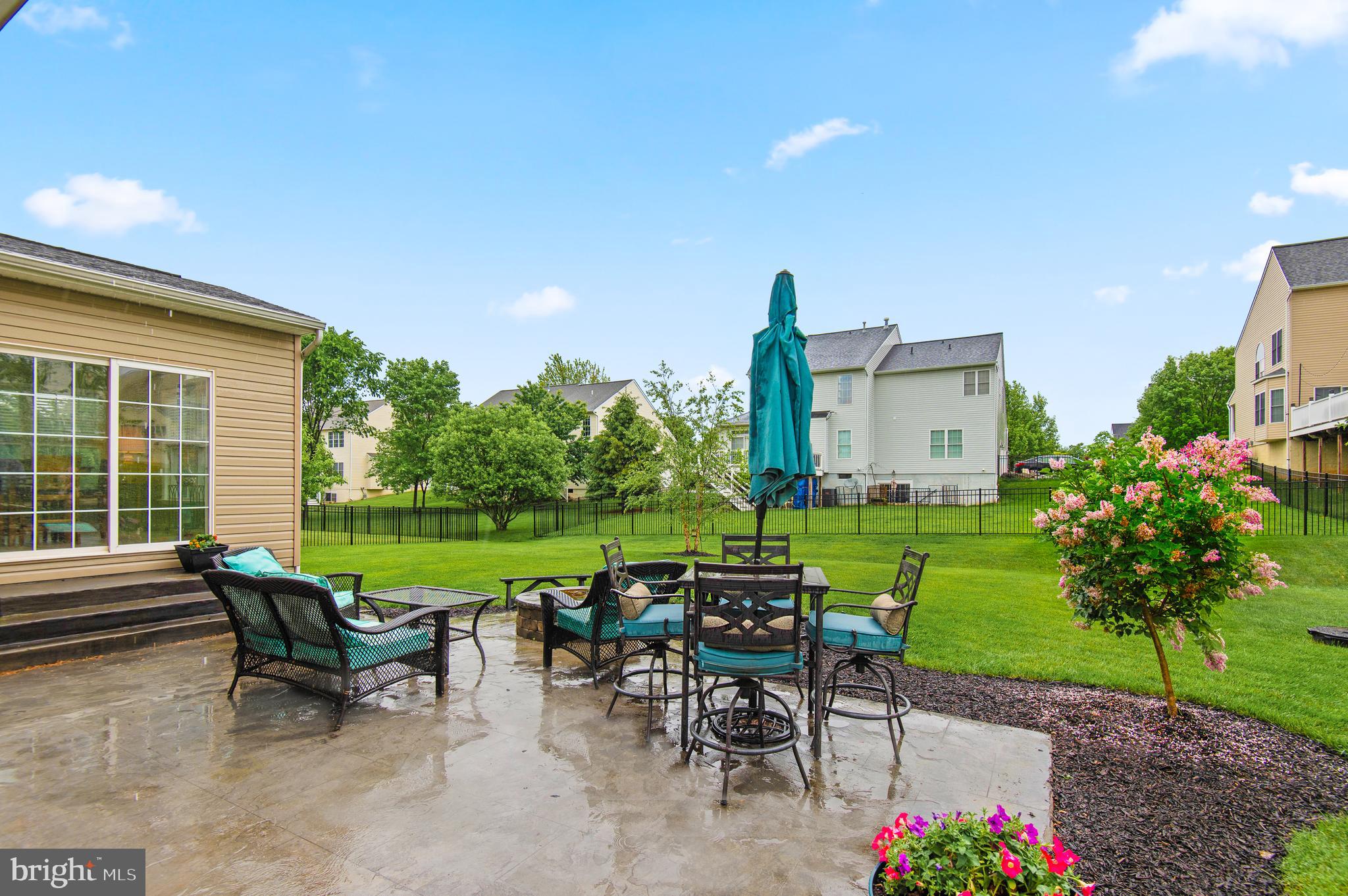 985 Silver Maple Circle Seven Valleys, PA 17360 - Photo 41 of 50 a view of a patio with table and chairs and potted plants