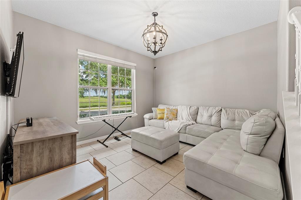 3523 Clay Brick Road St. Cloud, FL 34773 - Photo 6 of 62 a living room with furniture and a large window