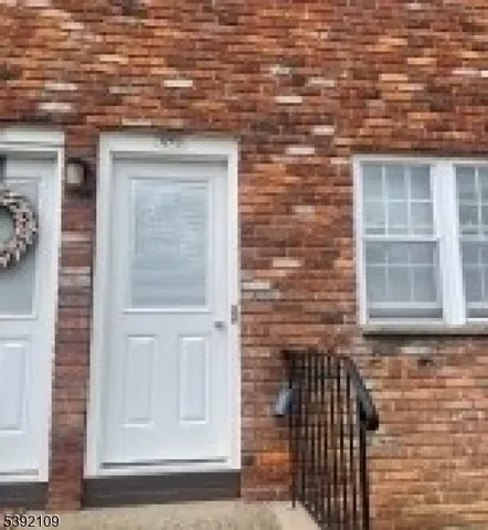 a front view of a house with an empty space