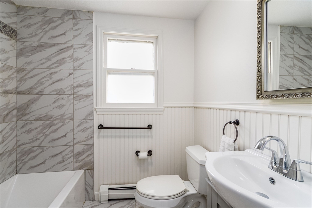 64 McNamara Road Yarmouth, MA 02673 - Photo 14 of 28 a bathroom with a sink a toilet and bathtub