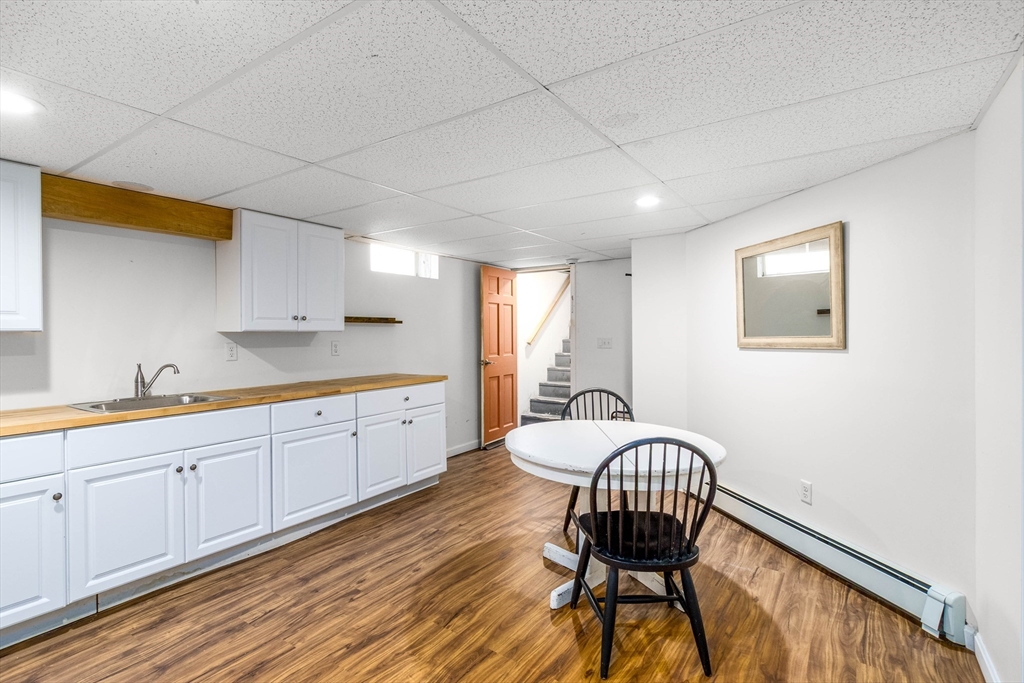 64 McNamara Road Yarmouth, MA 02673 - Photo 18 of 28 a spacious bedroom with a bed and wooden floor