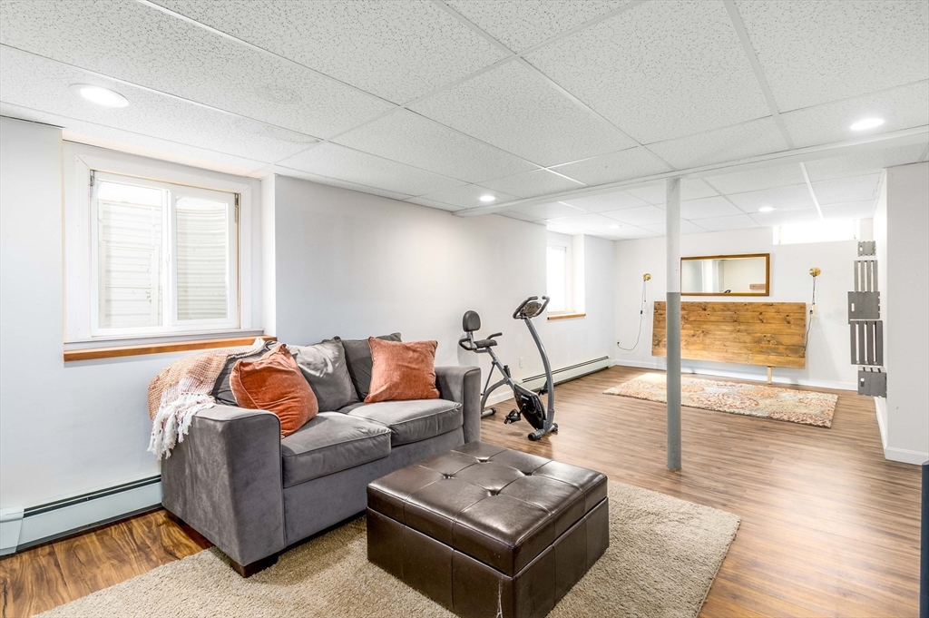 64 McNamara Road Yarmouth, MA 02673 - Photo 20 of 28 a living room with furniture and a table