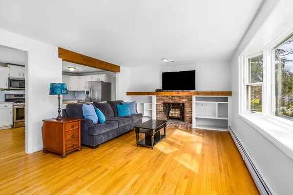 a living room with furniture and a fireplace