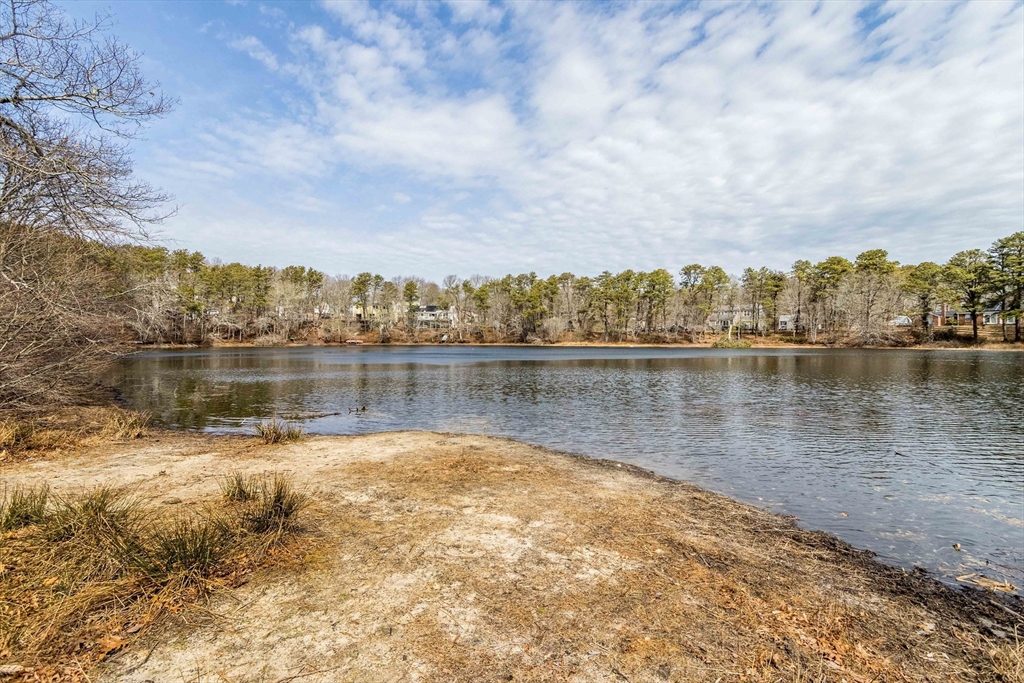 64 McNamara Road Yarmouth, MA 02673 - Photo 28 of 28 a view of a lake with houses in the back
