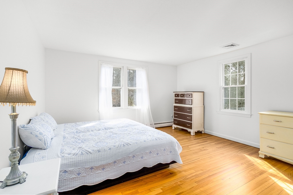 64 McNamara Road Yarmouth, MA 02673 - Photo 9 of 28 a bedroom with a bed and a window