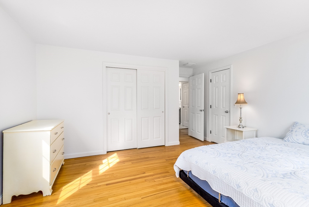 64 McNamara Road Yarmouth, MA 02673 - Photo 10 of 28 a bedroom with a bed and a view of bathroom