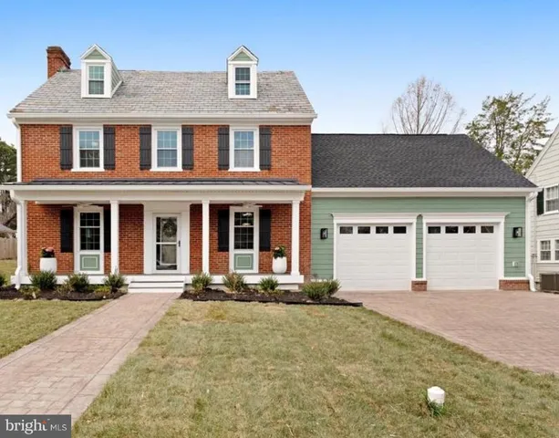 a front view of a house with yard