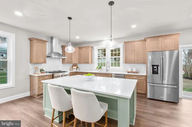 a bedroom with a large bed and a ceiling fan