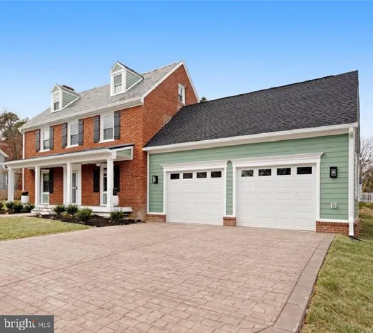 a front view of building with yard