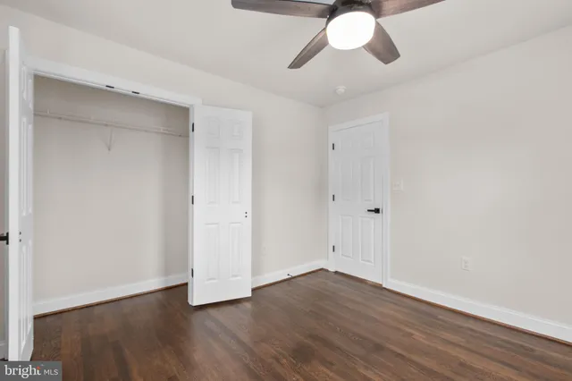 a view of empty room with wooden walls