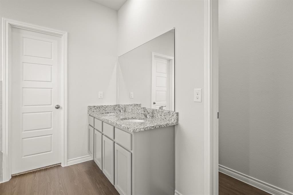 5025 Wellborn Road Crowley, TX 76036 - Photo 10 of 38 a bathroom with a granite countertop sink and a mirror