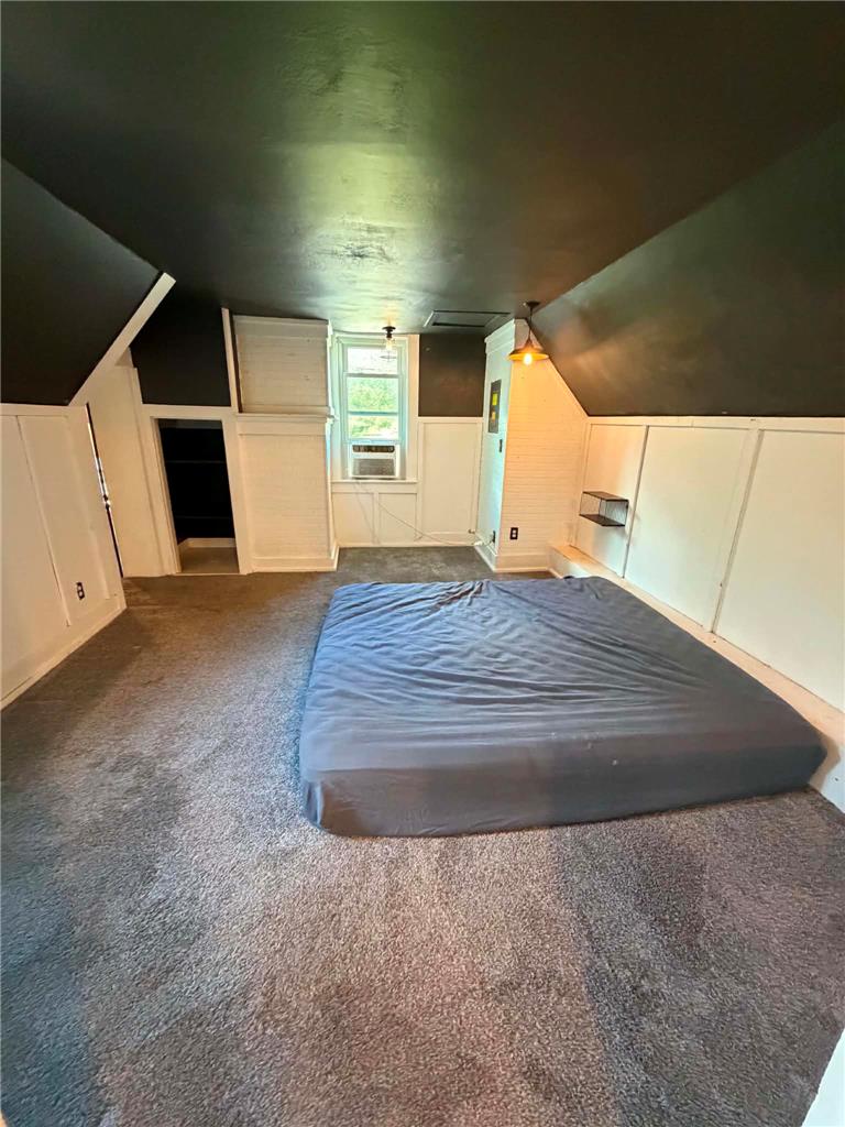 164 Sand Spring Road Cresco, PA 18326 - Photo 46 of 60 An inviting attic bedroom offers plush carpeting and a bright window for comfortable living.