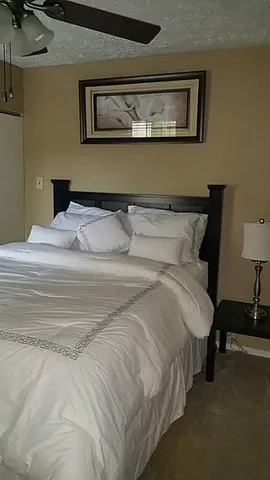 a bedroom with furniture and a fireplace