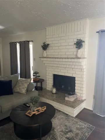 a kitchen with granite countertop a stove and a microwave