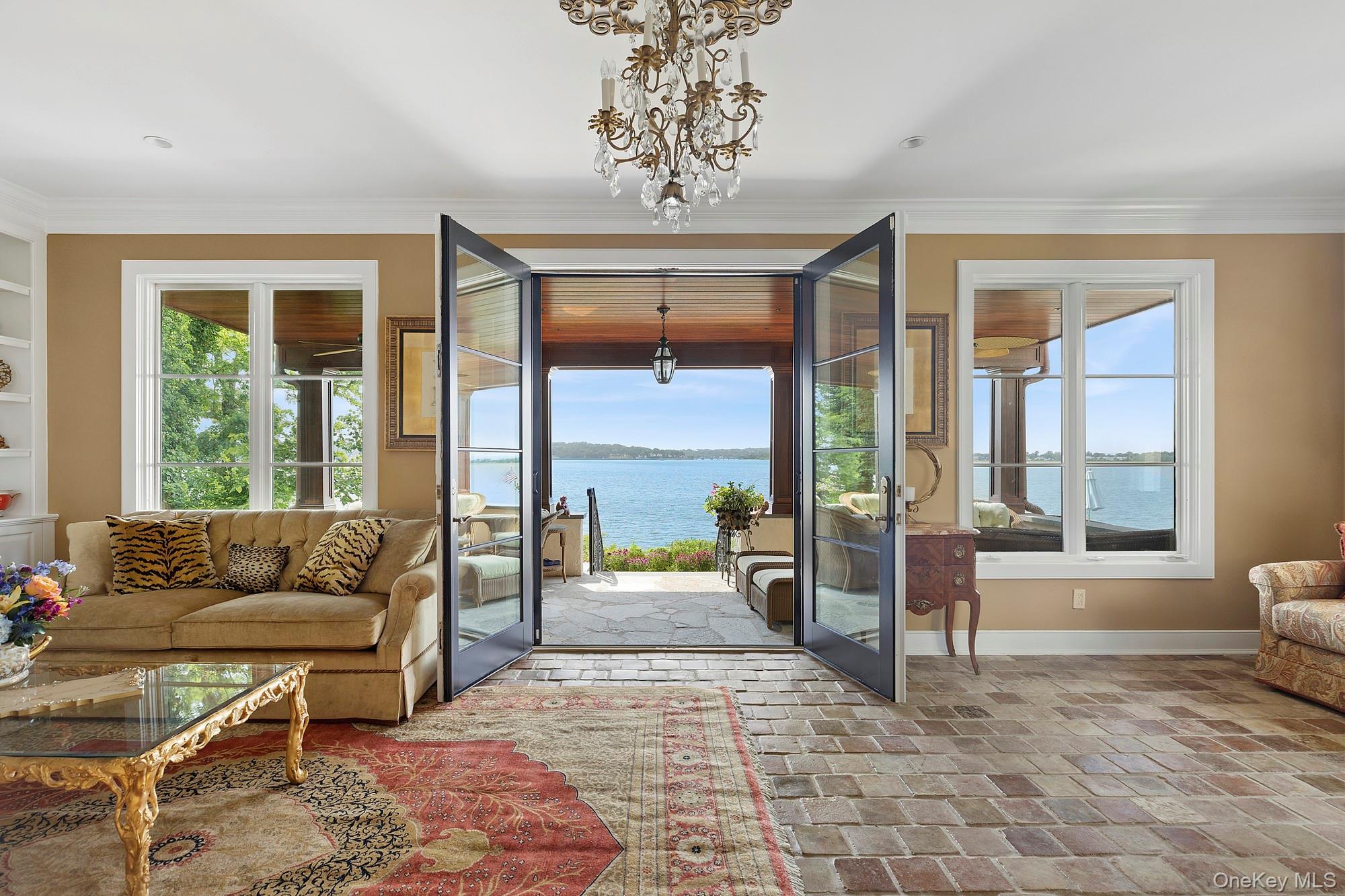 353 Centre Island Road Oyster Bay, NY 11771 - Photo 11 of 34 a living room with furniture and a large window