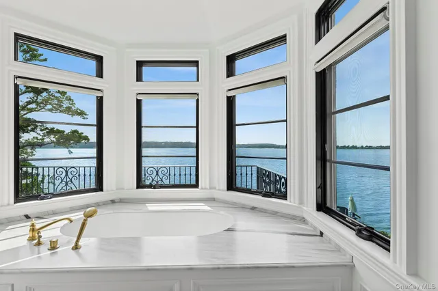 a view of an entryway with wooden floor and door