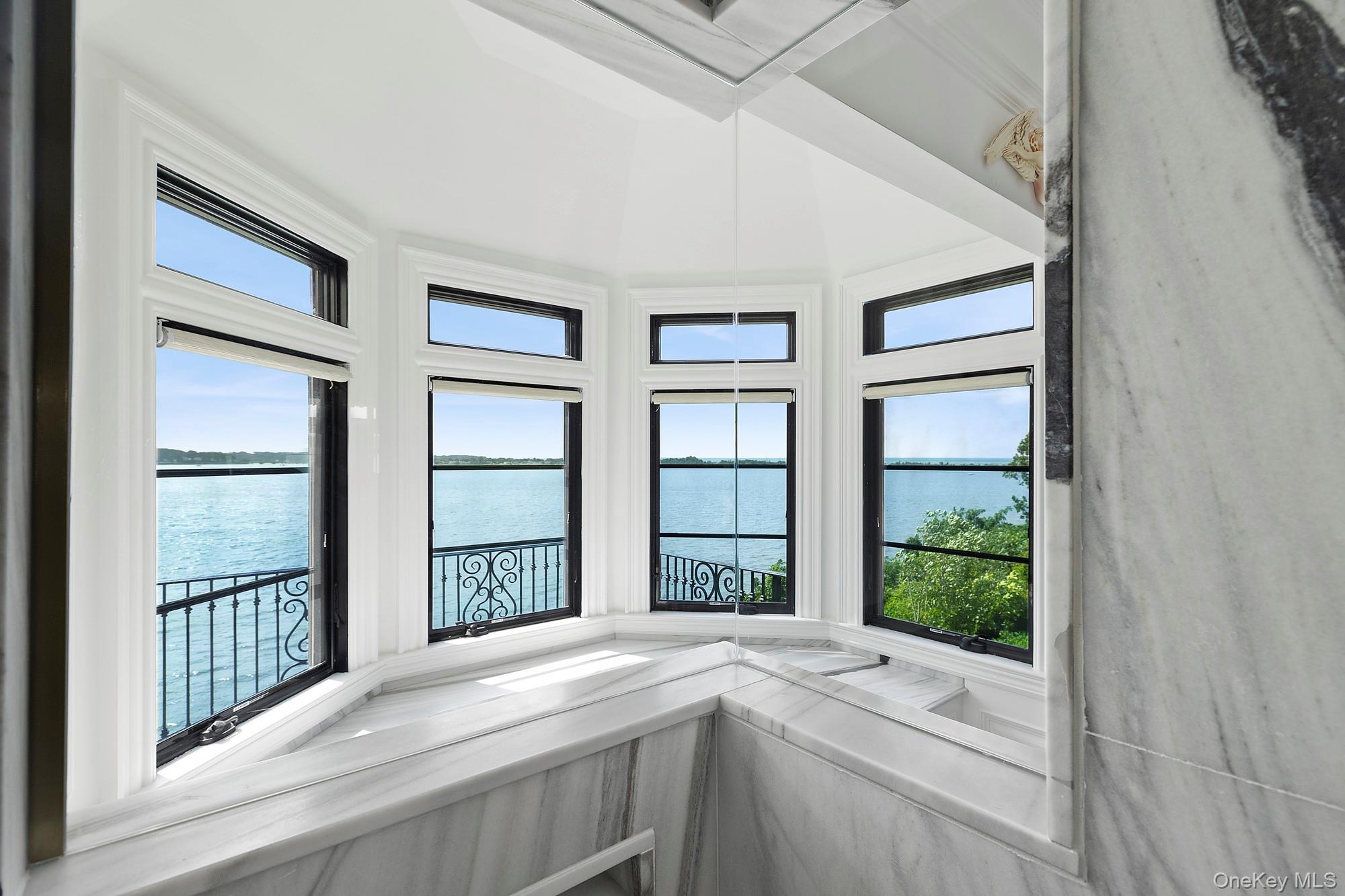 353 Centre Island Road Oyster Bay, NY 11771 - Photo 17 of 34 a view of an entryway with wooden floor and door