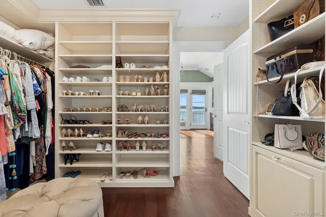 a bathroom with a double vanity sink a mirror and a bathtub